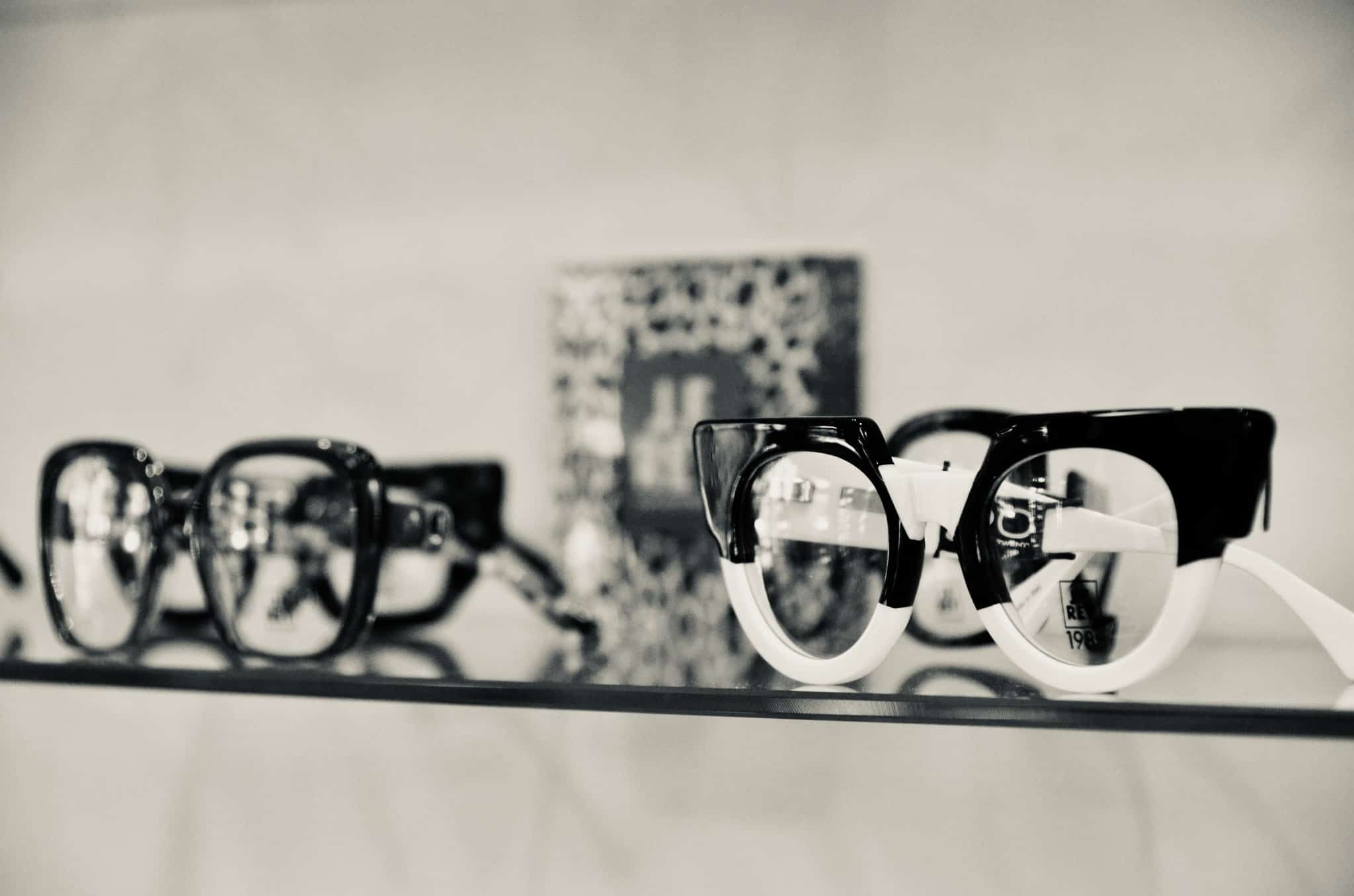 Black and White Glasses resting on shelf