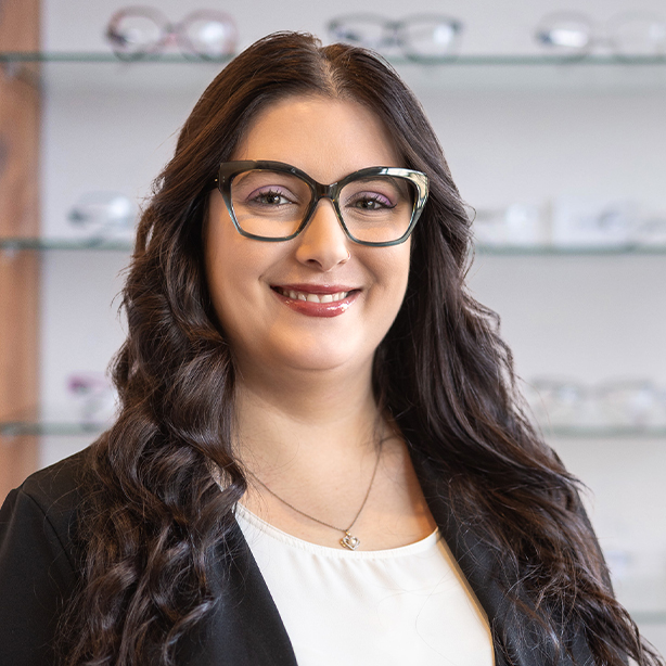 Female optometrist smiling inside Focal Point Optometry clinic in Qualicum Beach